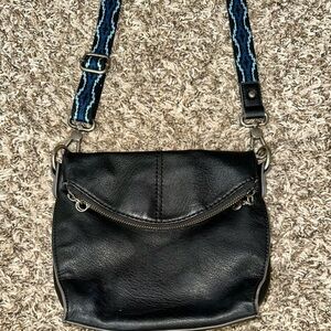 The Sak Soft Black Textured Leather Crossbody w/ Blue/Black Woven Strap